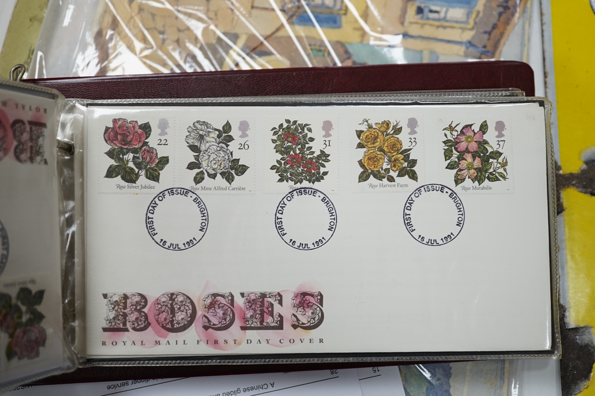 A box of UK and European First Day Covers in various albums